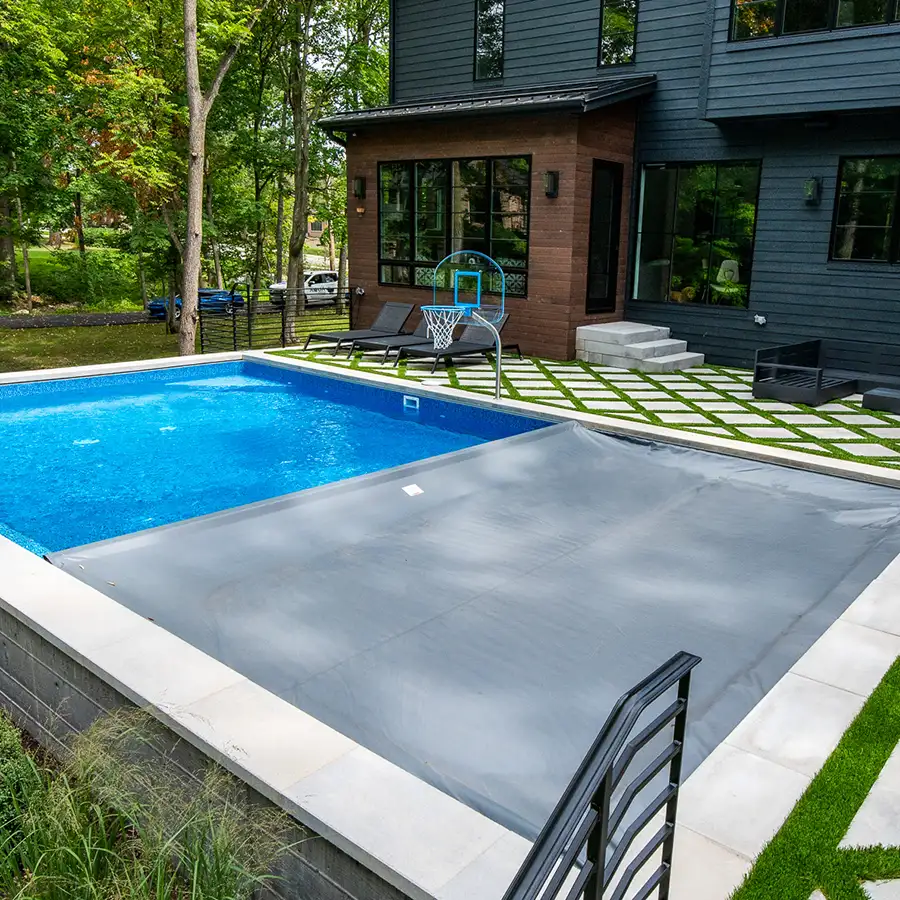 Latham Pool Products - Coverstar automatic safety cover in charcoal with undertrack Installed and photographed by Aqua Pools - Decatur, IL